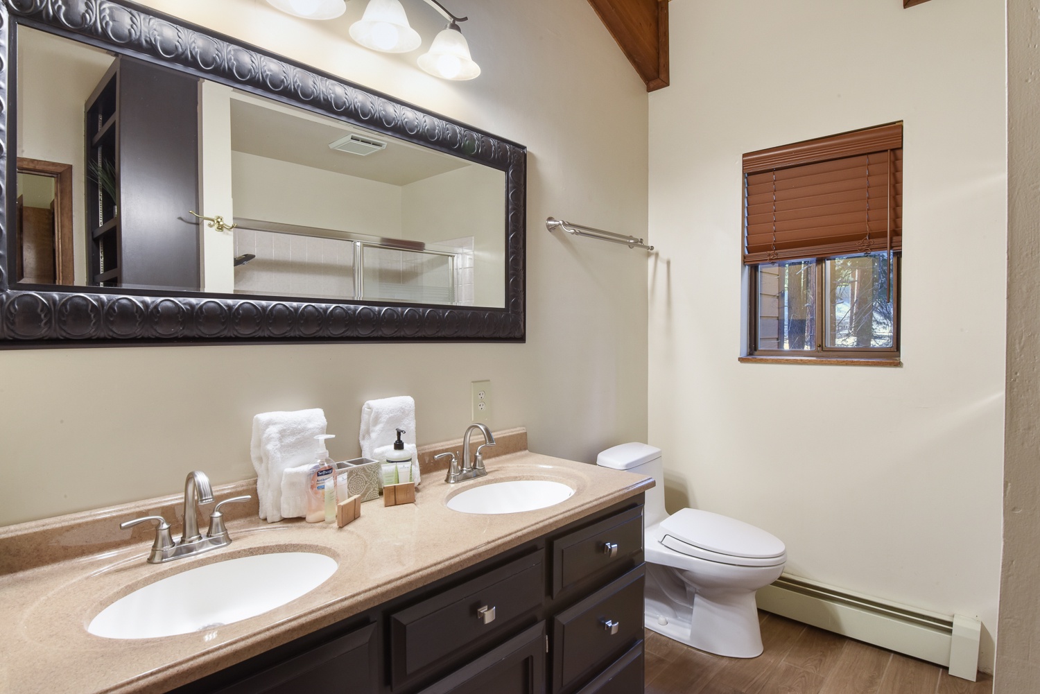 Unit #2: The 3rd level bathroom offers a spacious double vanity & shower/tub combo