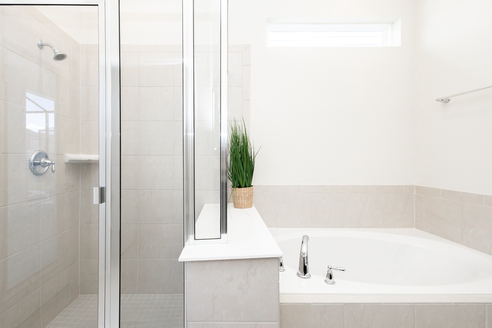 The 1st floor king en suite includes a dual vanity, glass shower, & soaking tub