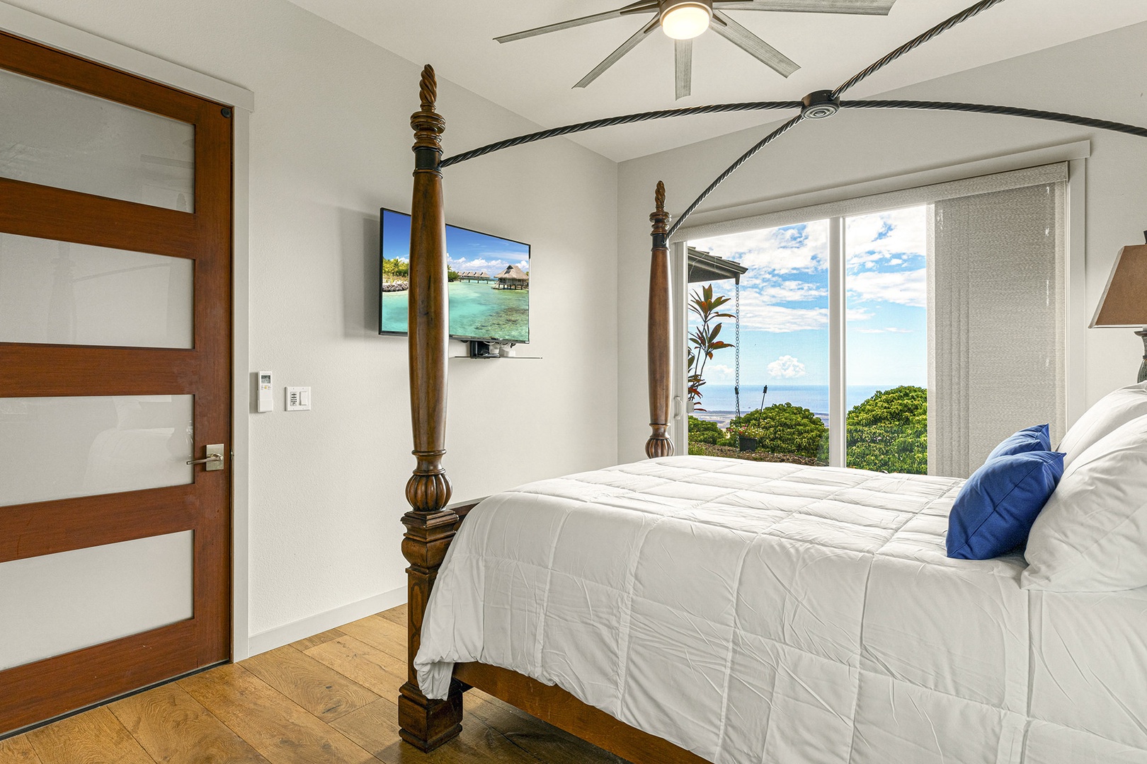 Bedroom 2 with King bed, TV, ocean view, and ensuite