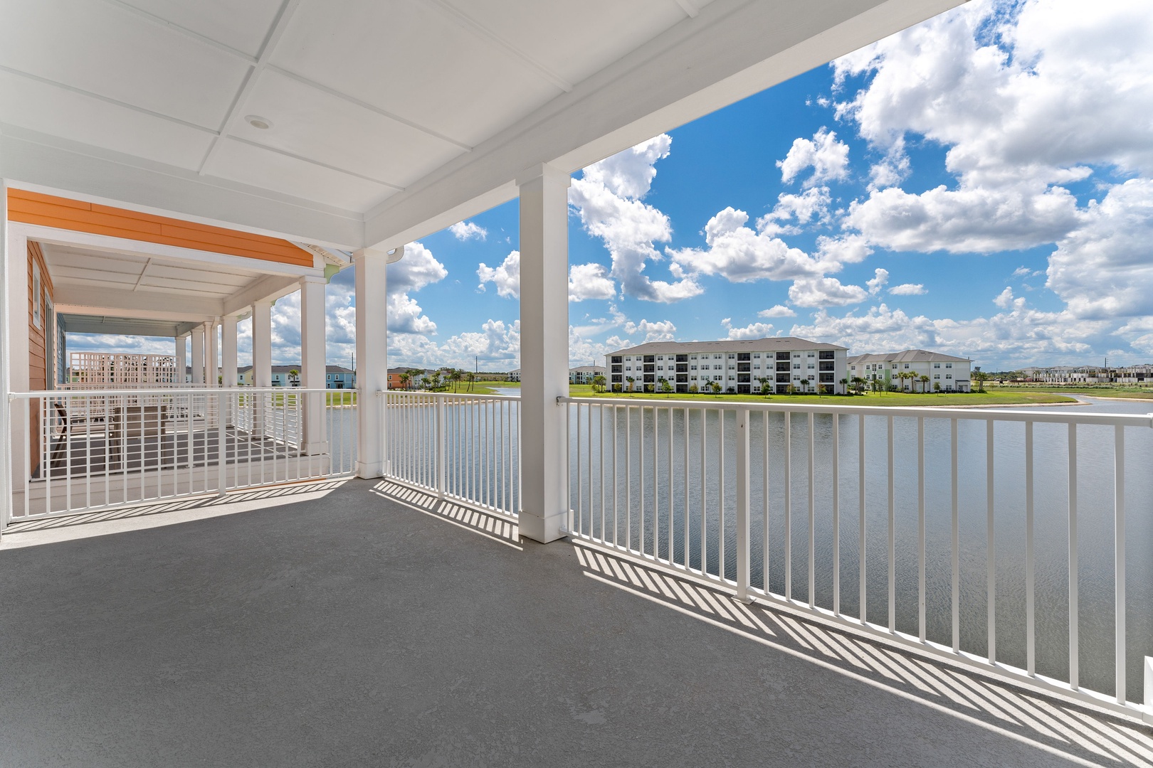 Coastal charm: King bed, smart TV, and balcony with water view