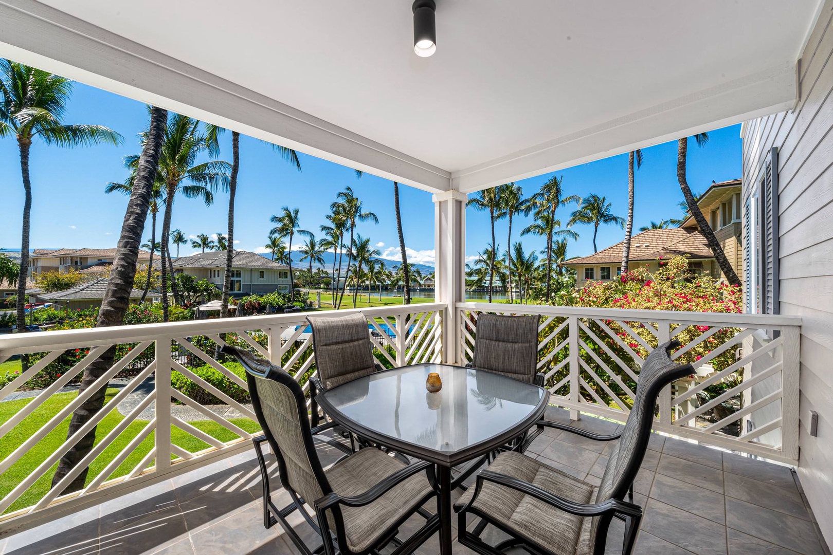 Lanai with patio seating, with garden view, across pool!