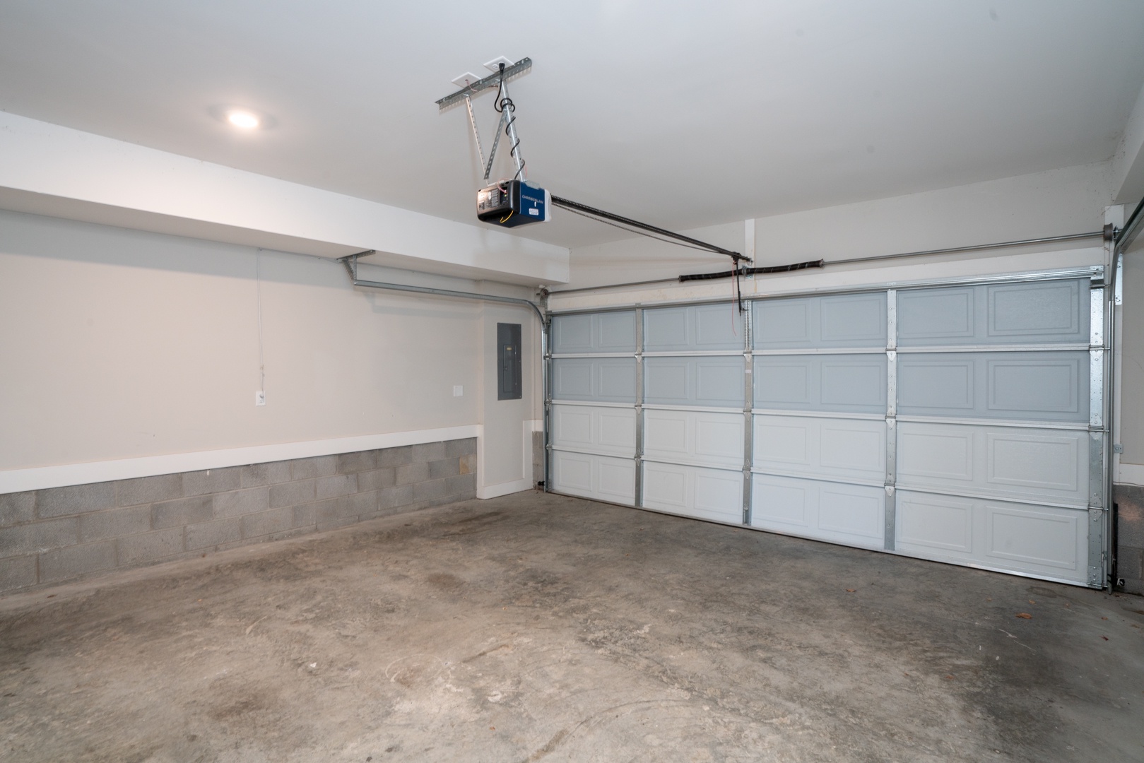 The garage offers parking space for up to 2 vehicles