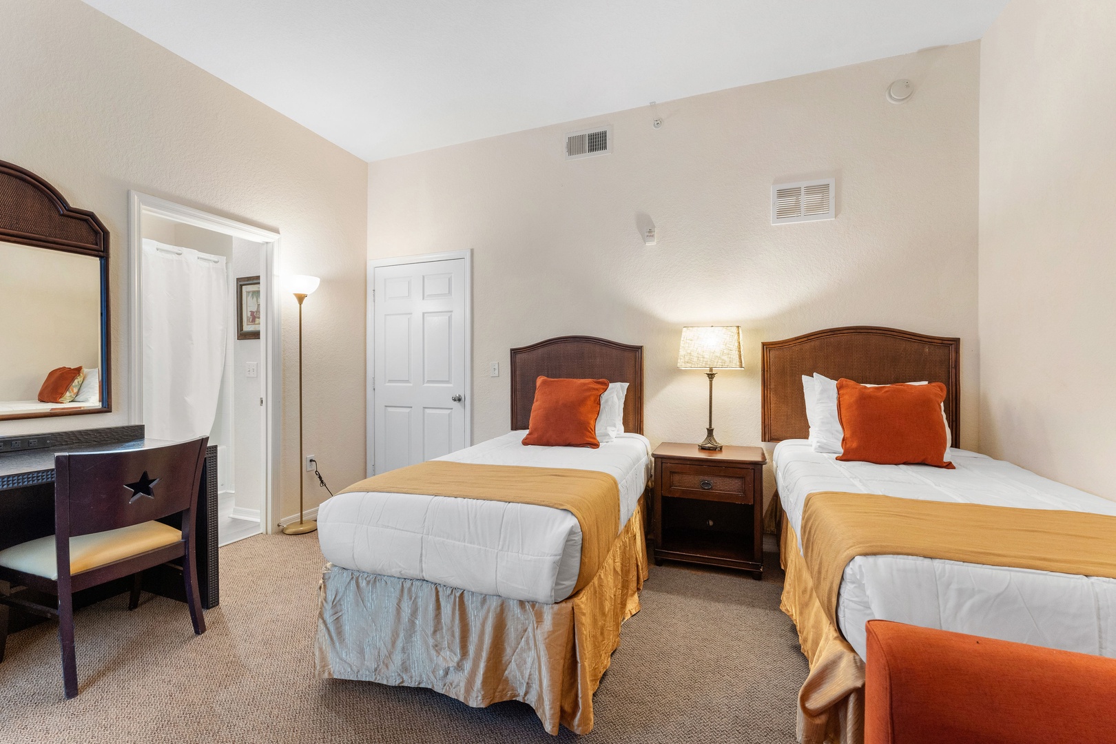 A pair of plush twin beds awaits in the first bedroom retreat with