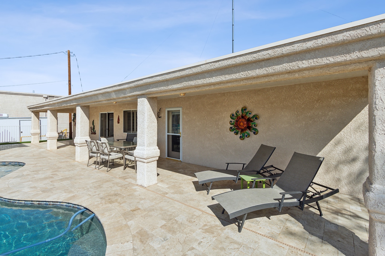 A mountain-view oasis, with a waterfall pool, hot tub, & outdoor kitchen!