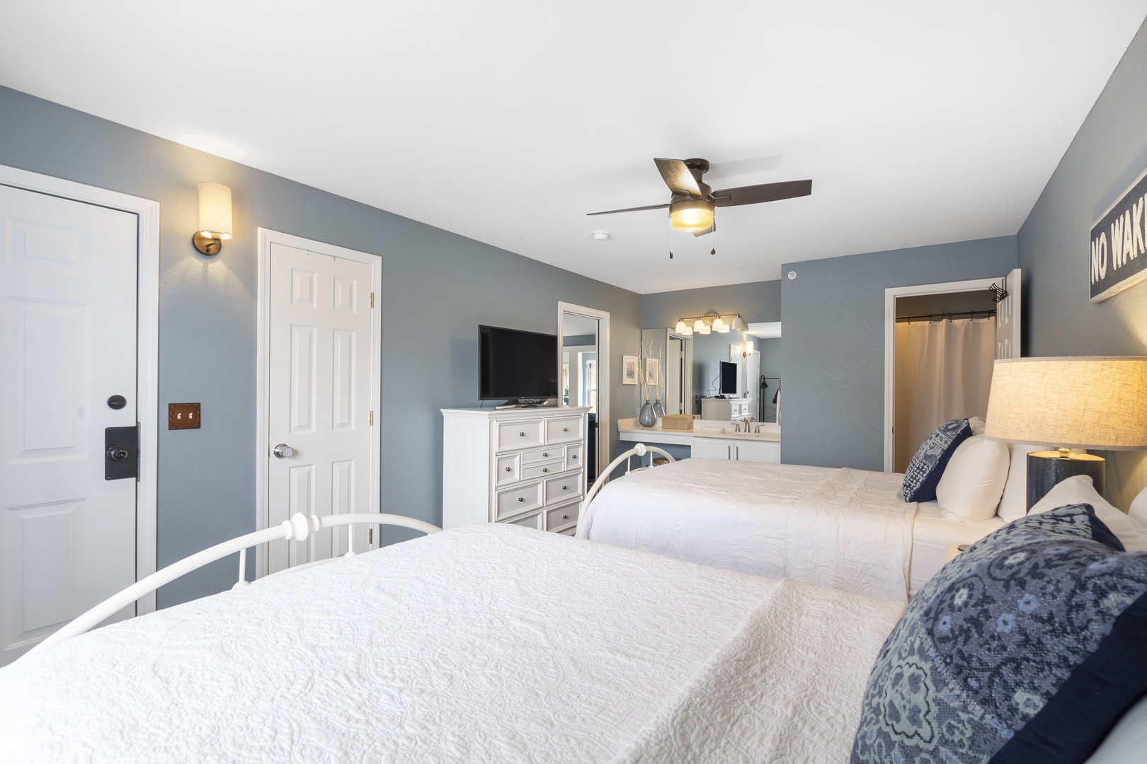 The 1st bedroom retreat boasts a pair of queen beds, private ensuite, & TV