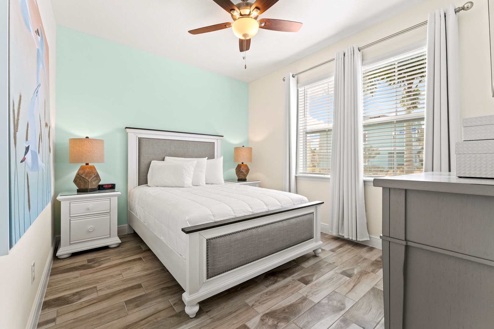 Sink into serenity in the first bedroom, with a queen bed & Smart TV