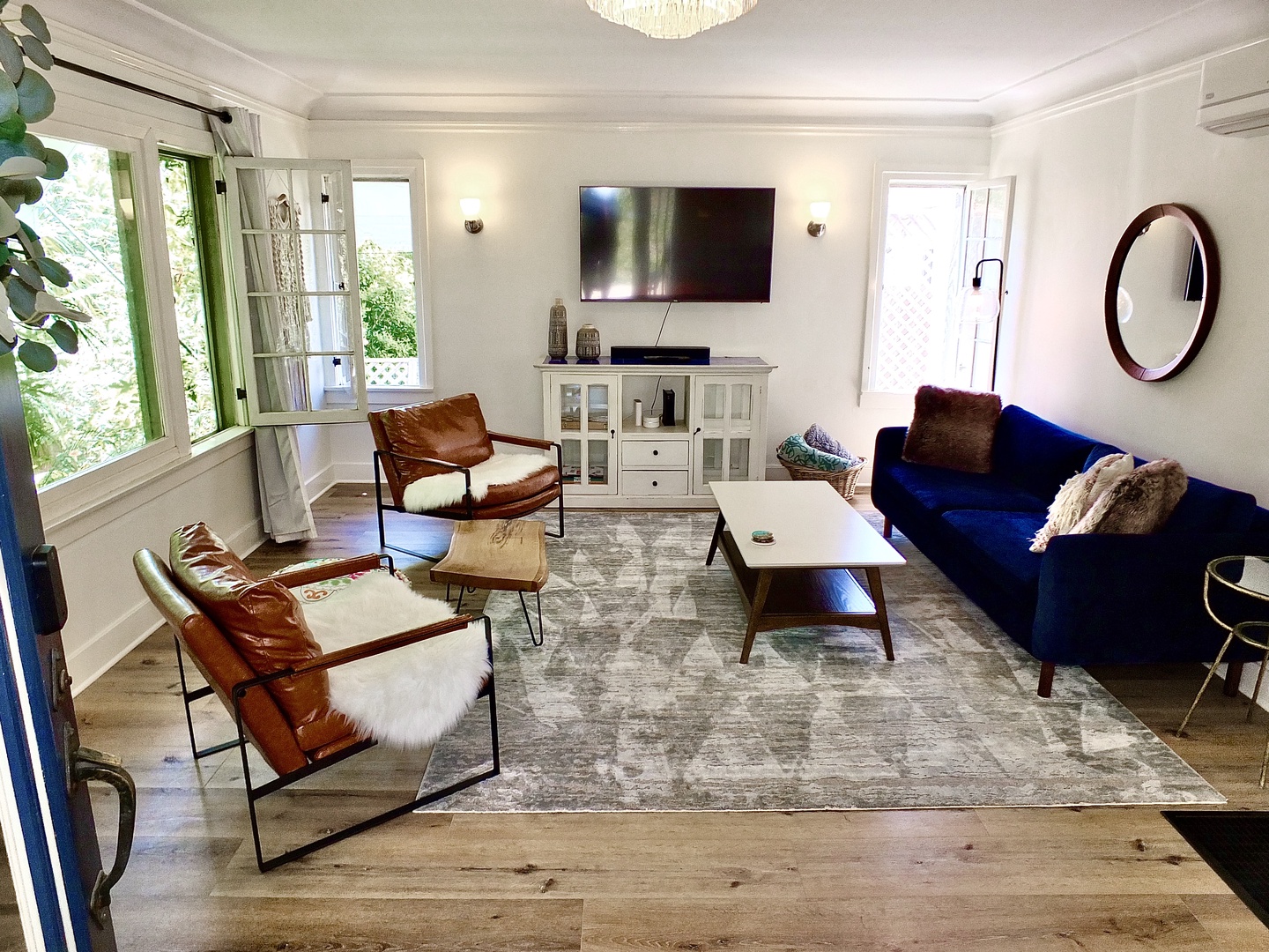 Bright living room with ample seating and Smart TV