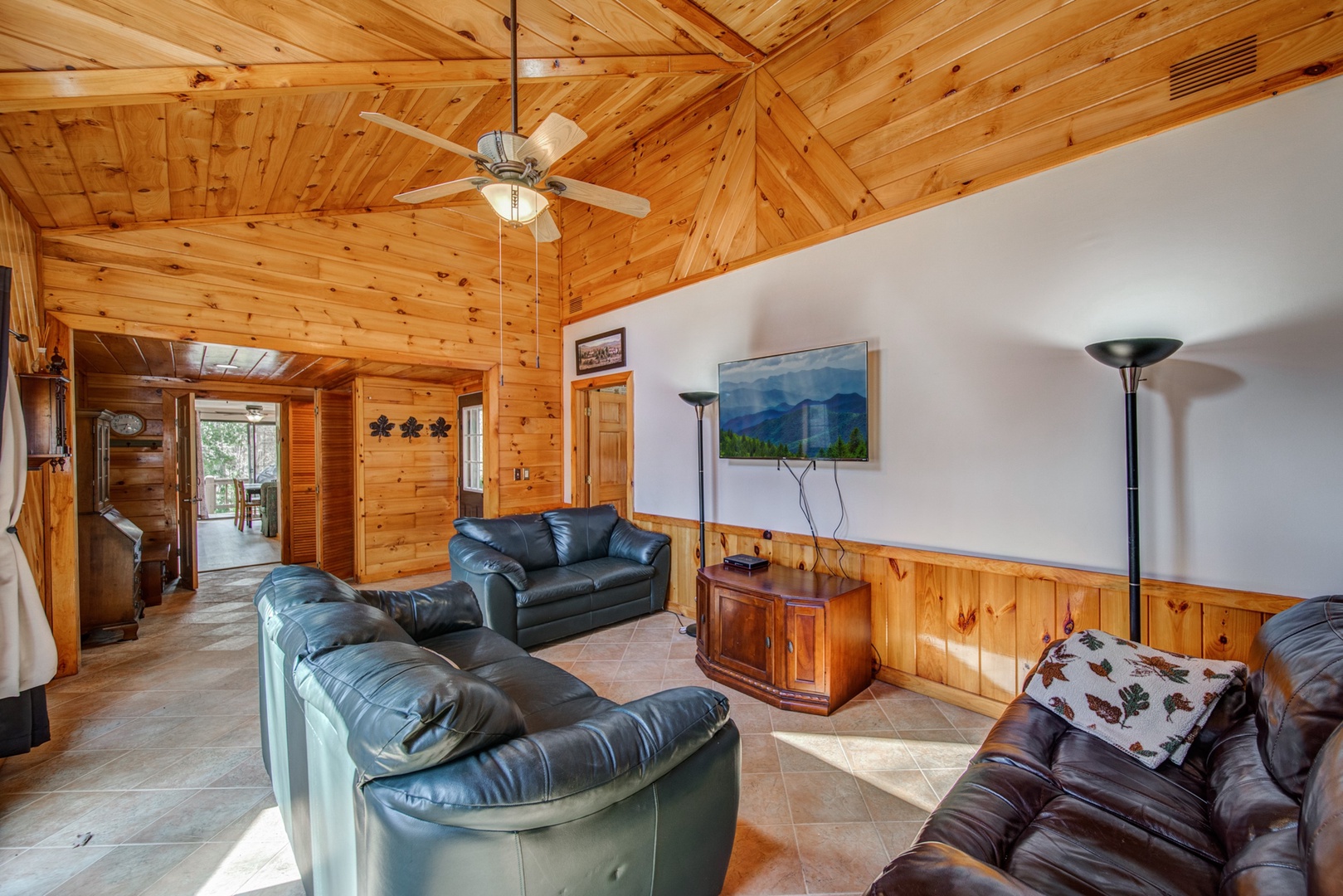 Enjoy plush seating and soaring wood ceilings while kicking back to enjoy a movie in the Living Area