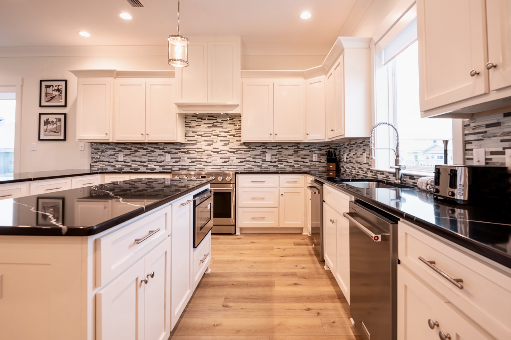 Kitchen boasts dual islands, fully equipped