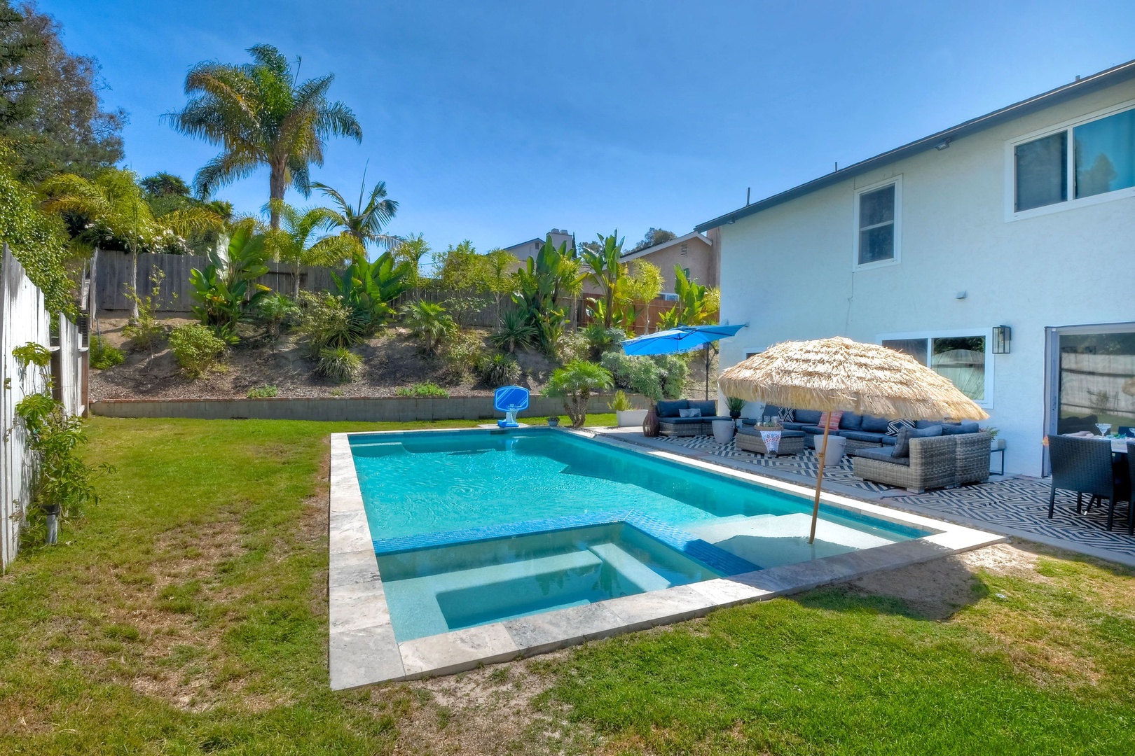 Backyard with ample seating and private pool