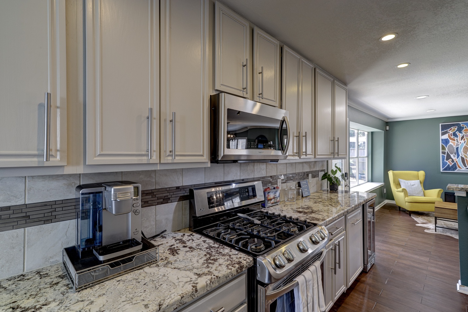 The open, airy kitchen offers ample space & all the comforts of home