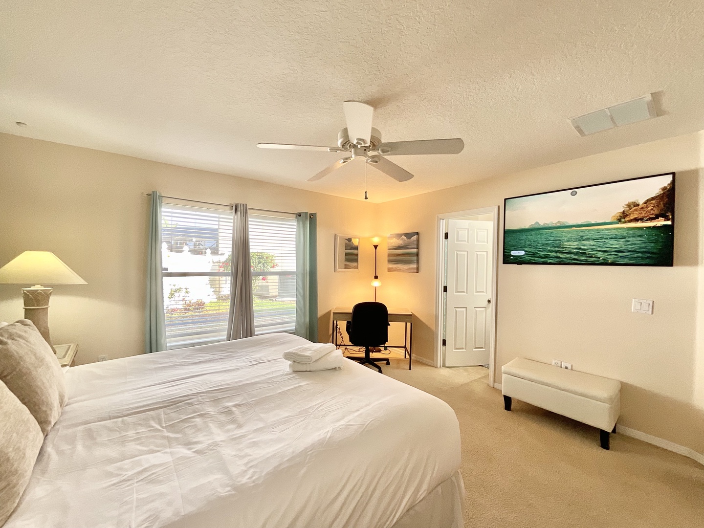 Bedroom 1 with king bed, Smart TV, and ensuite and desk