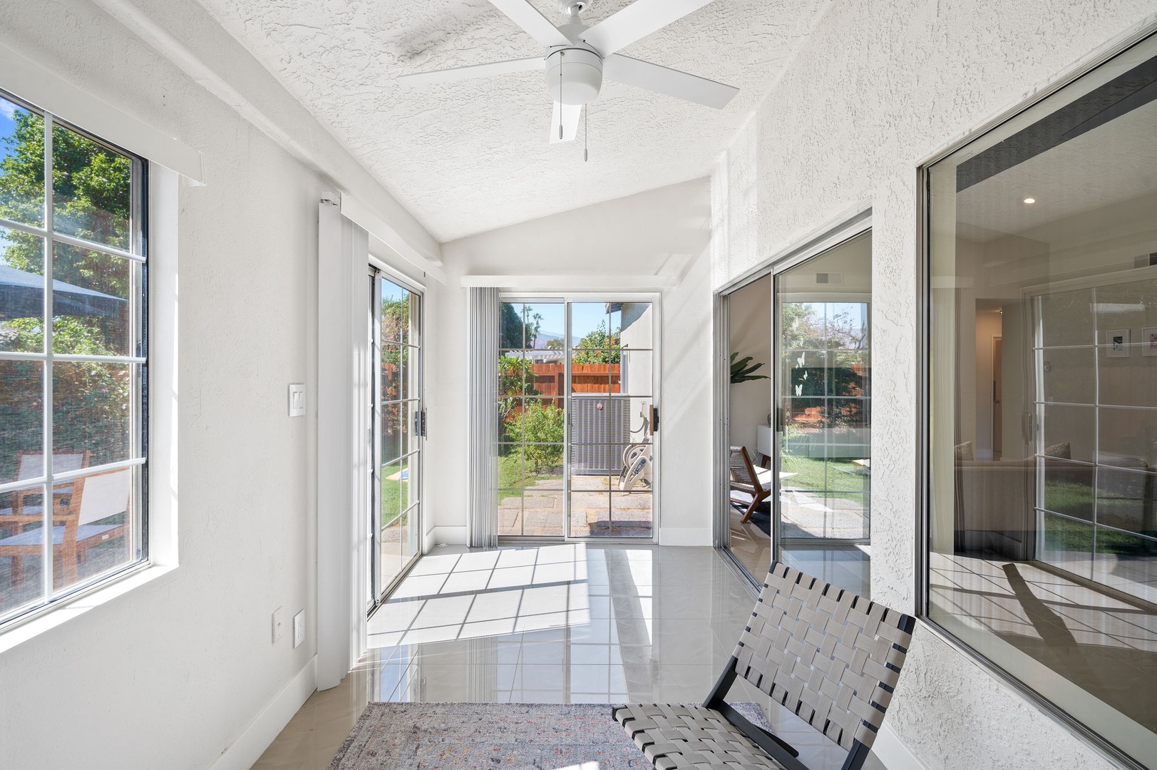 Enjoy fresh air and sunshine in the comfortable sunroom