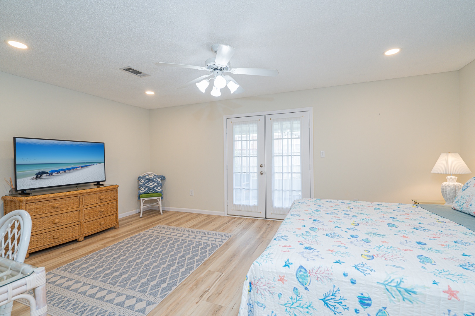 This coastal king suite boasts a private ensuite, smart TV, & patio access