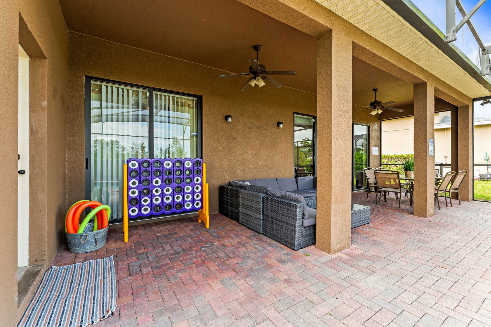 Private screened pool with outdoor seating, games & ceiling fans