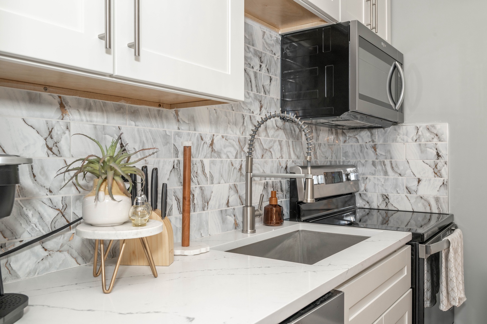 The modern kitchen provides plenty of space & homey comforts