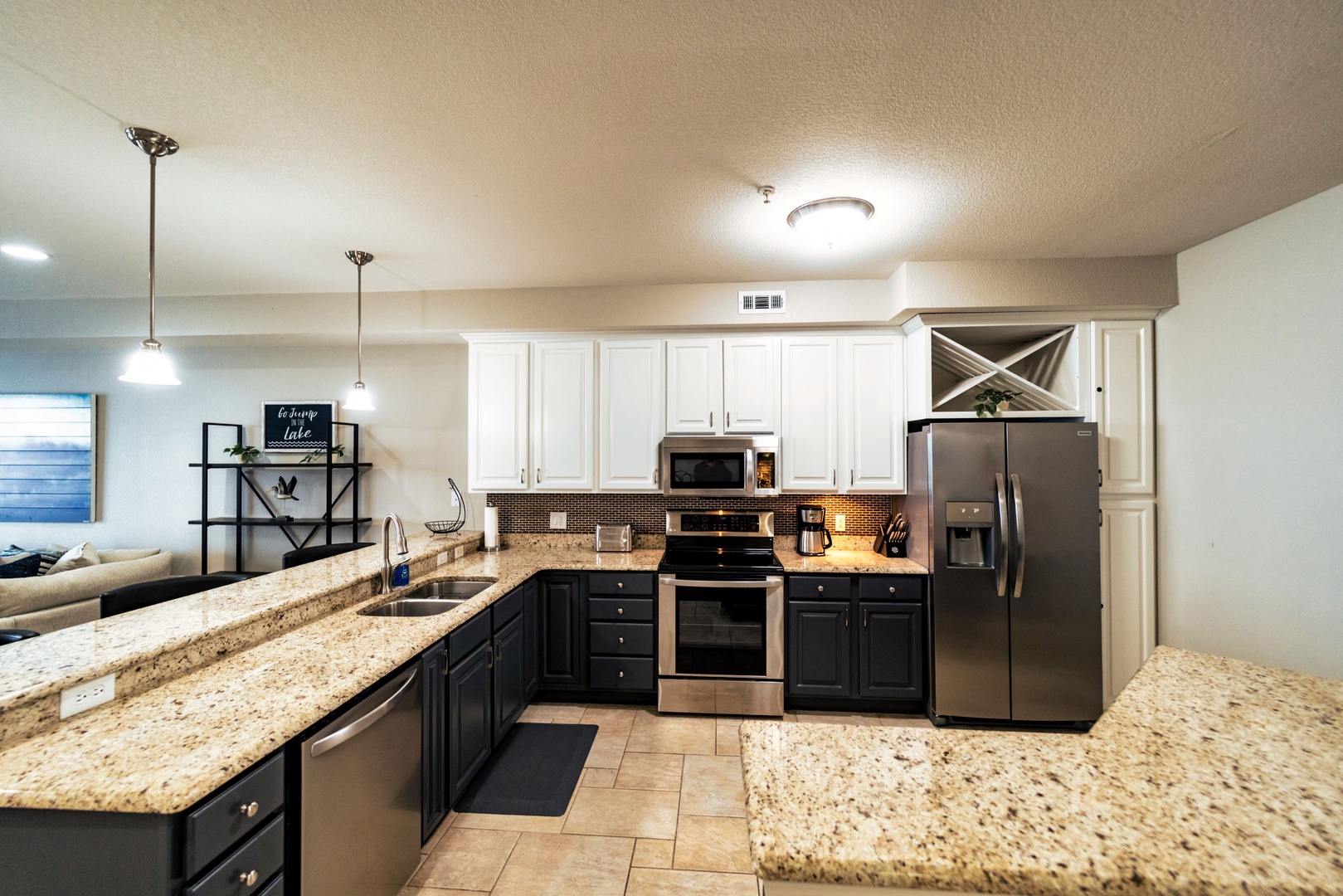 The airy, open kitchen offers ample storage & all the comforts of home