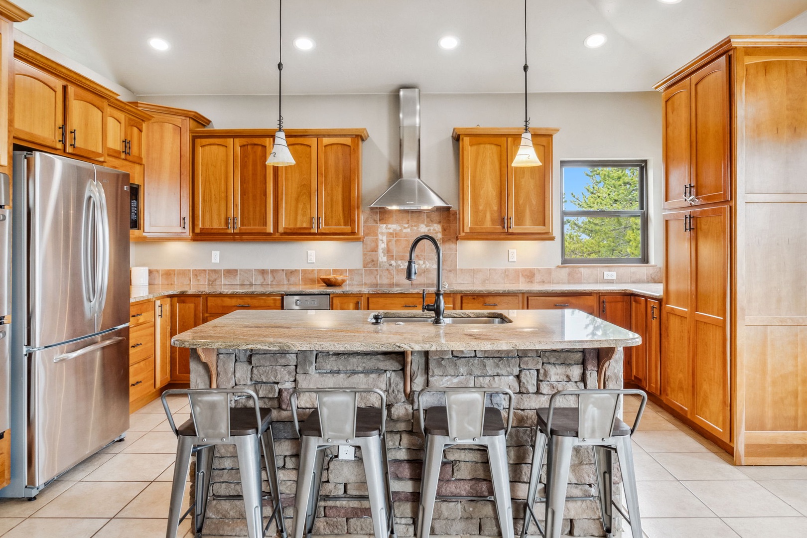 The open, airy kitchen offers ample space & all the comforts of home