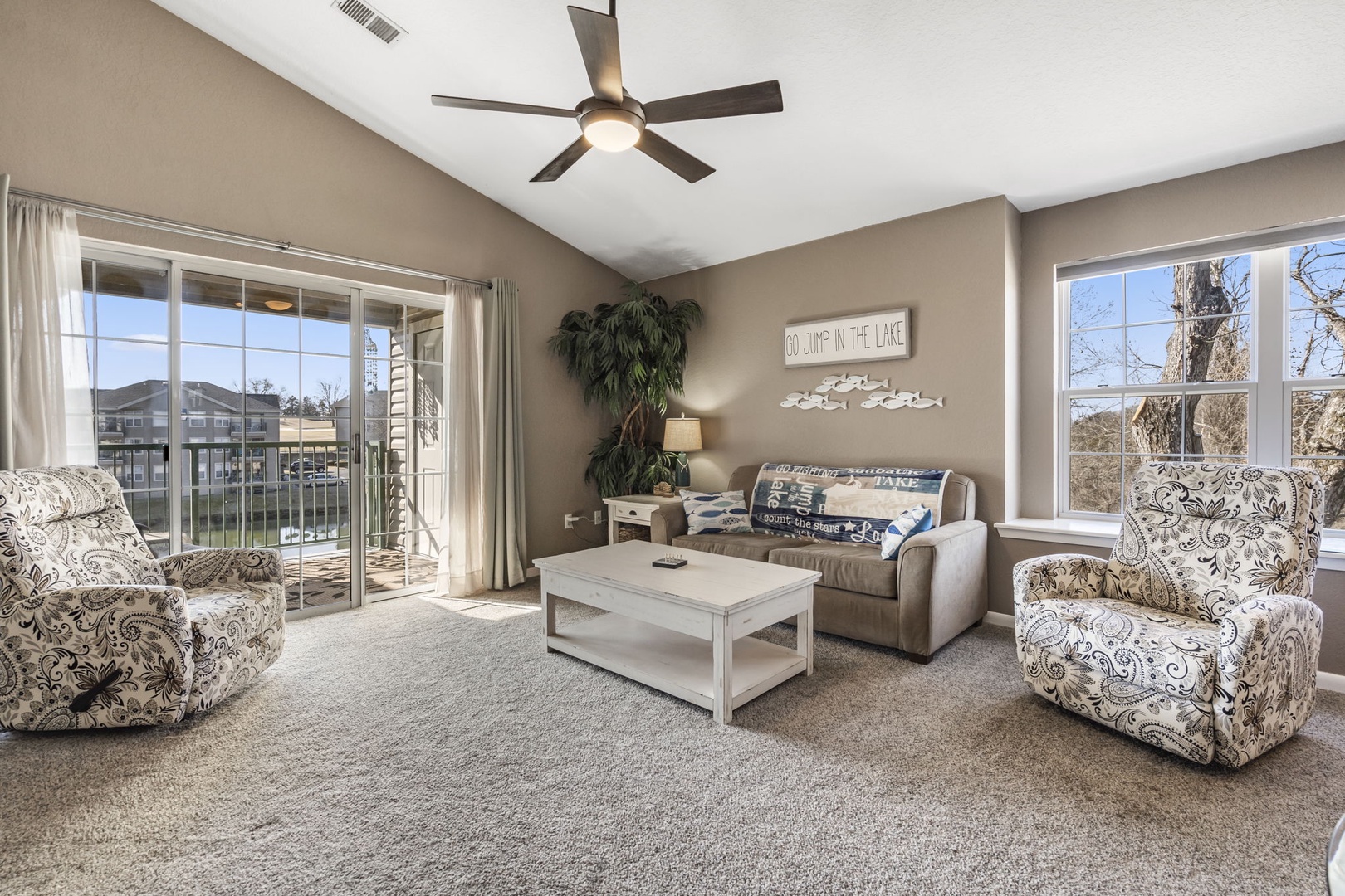 Open living space with sofa sleeper, Smart TV, and dining area