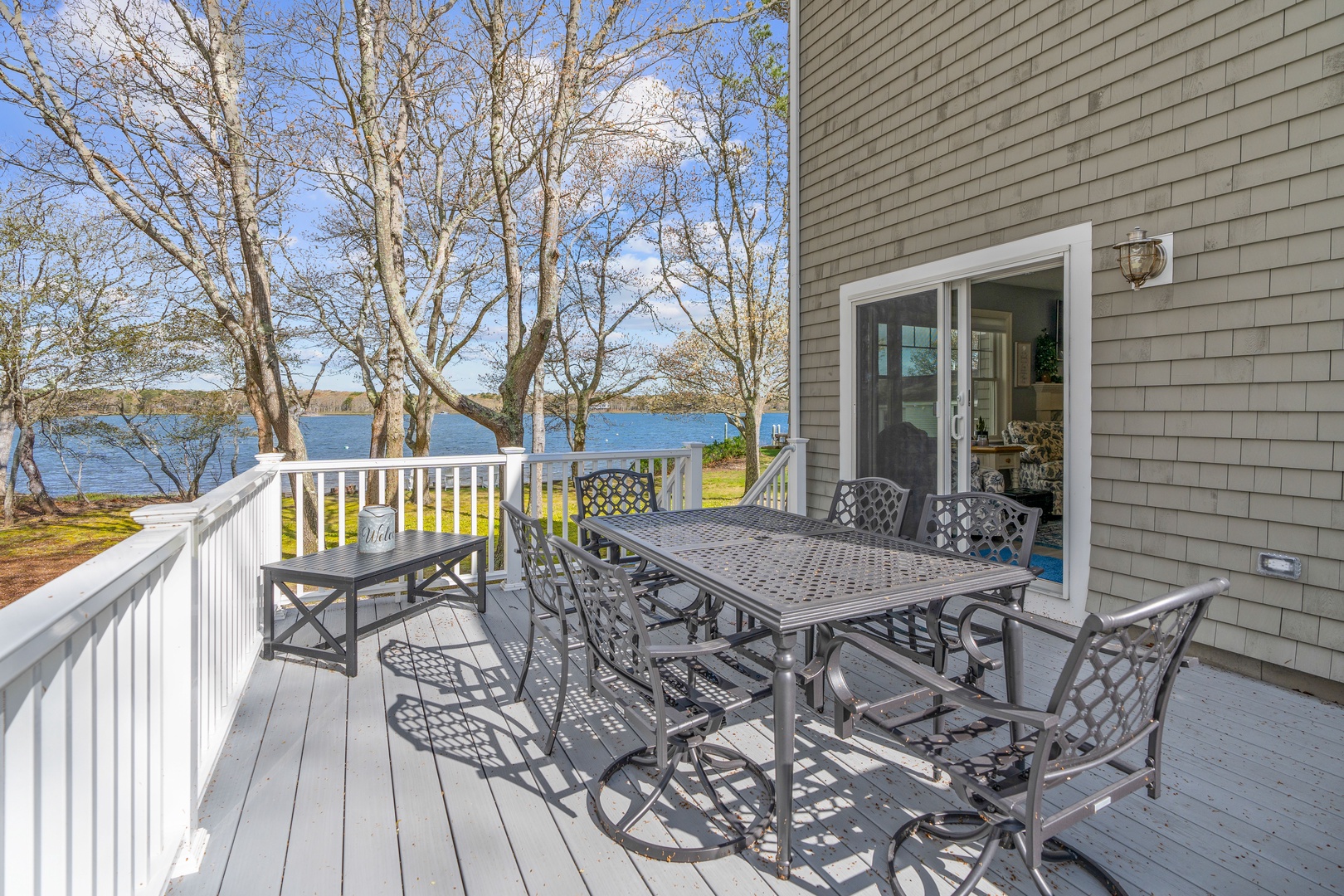 Deck with water view and outdoor seating