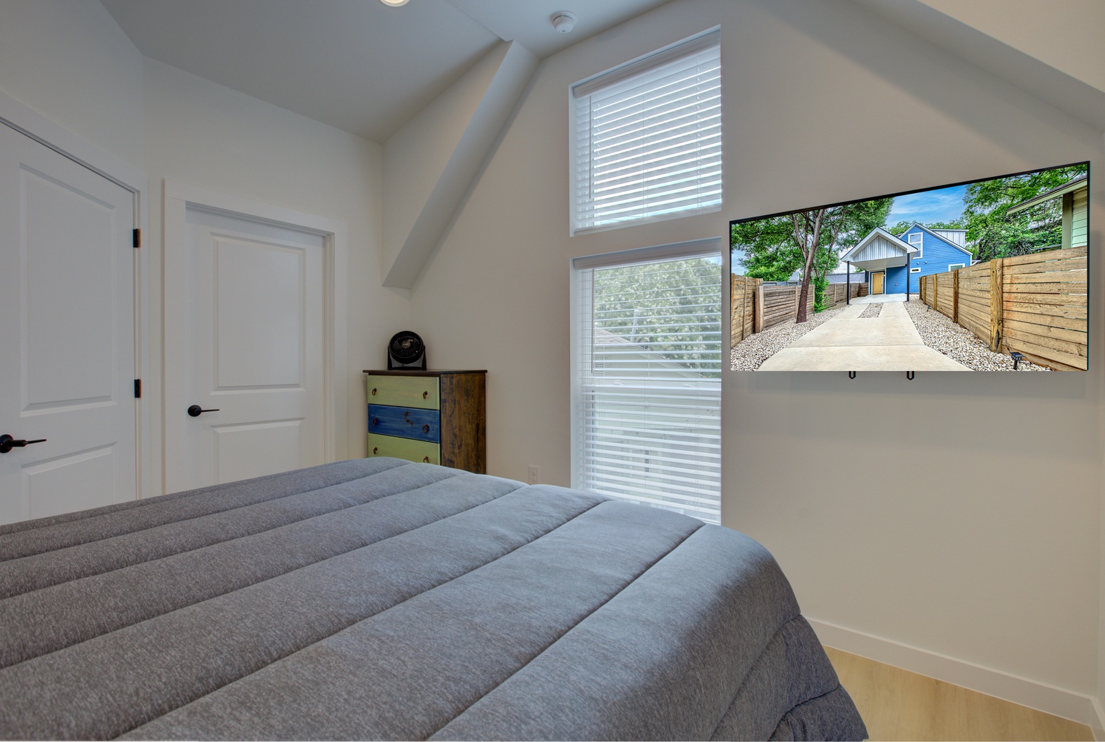 Bedroom 2 with queen bed, Smart TV, and ensuite