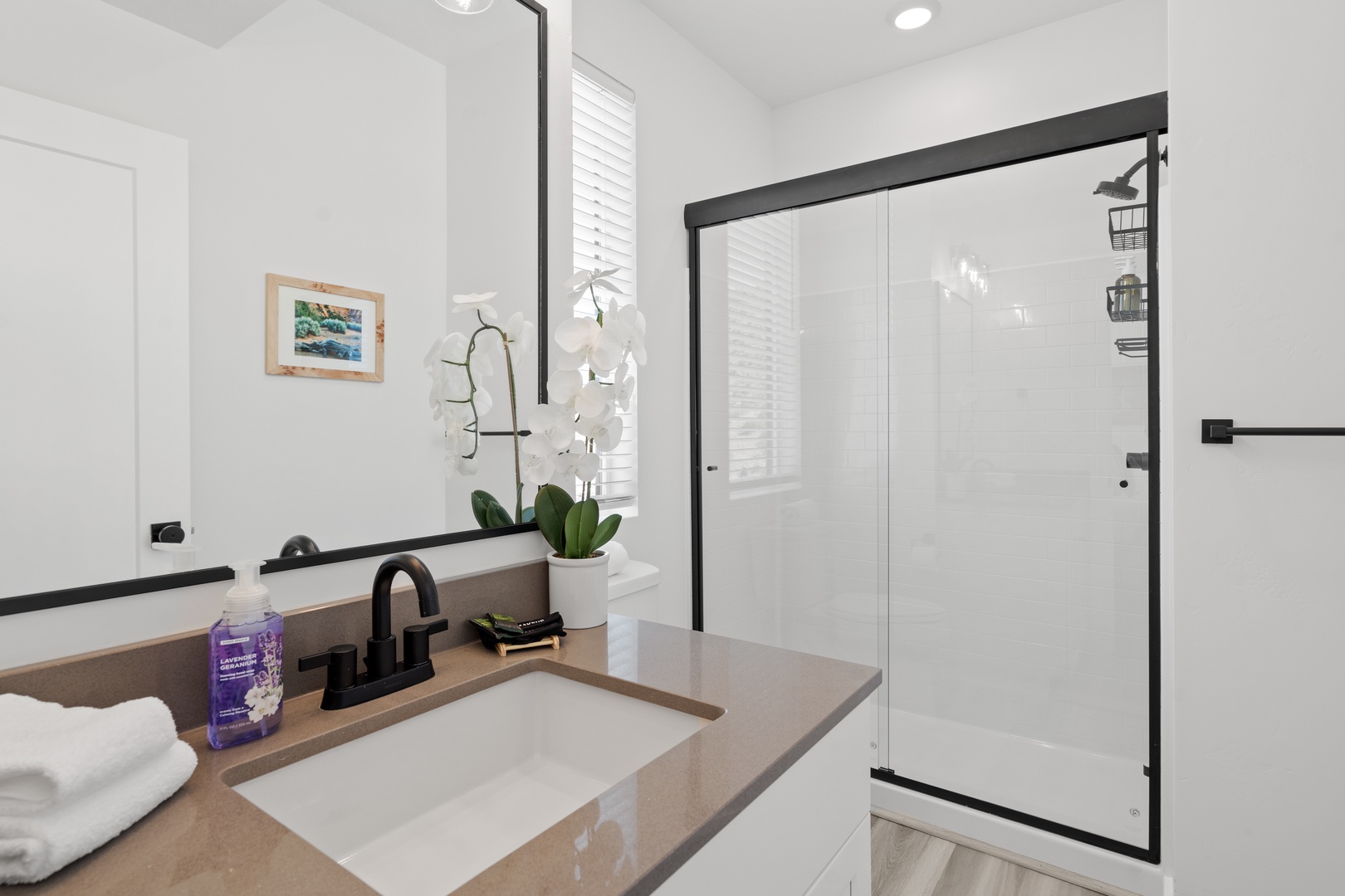 Start the day in this ensuite, with a single vanity & glass shower