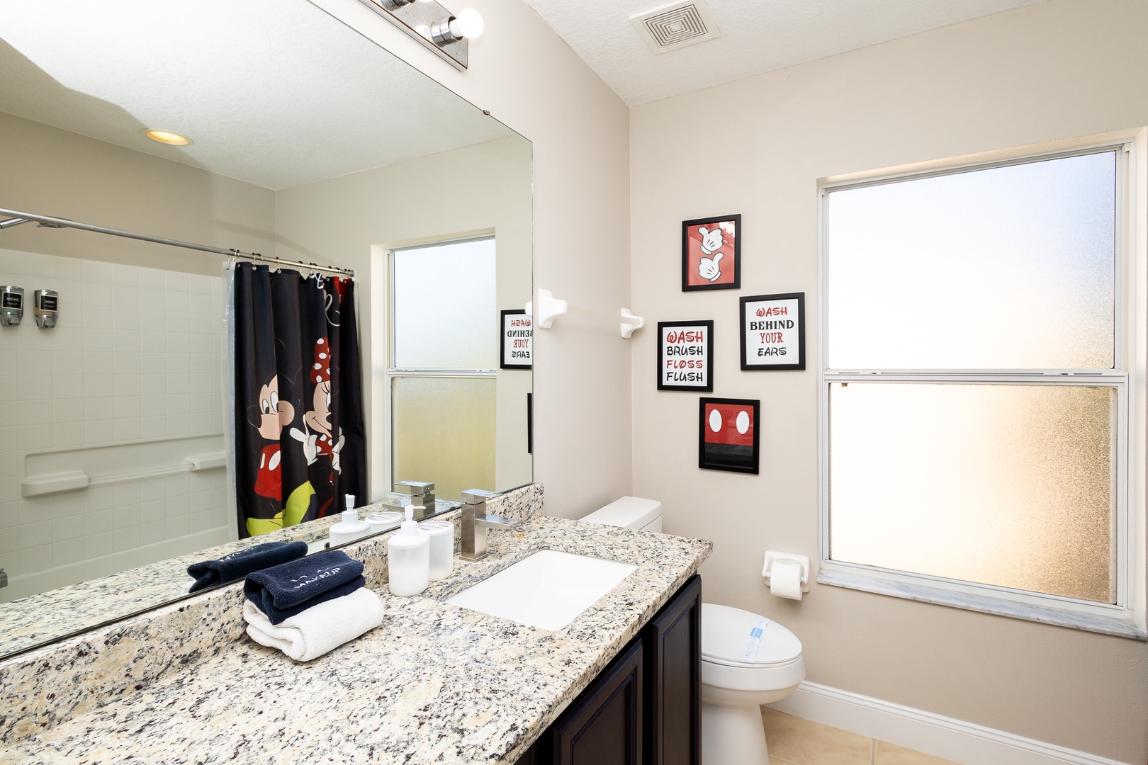 This 2nd-floor full bath offers a large single vanity & shower/tub combo