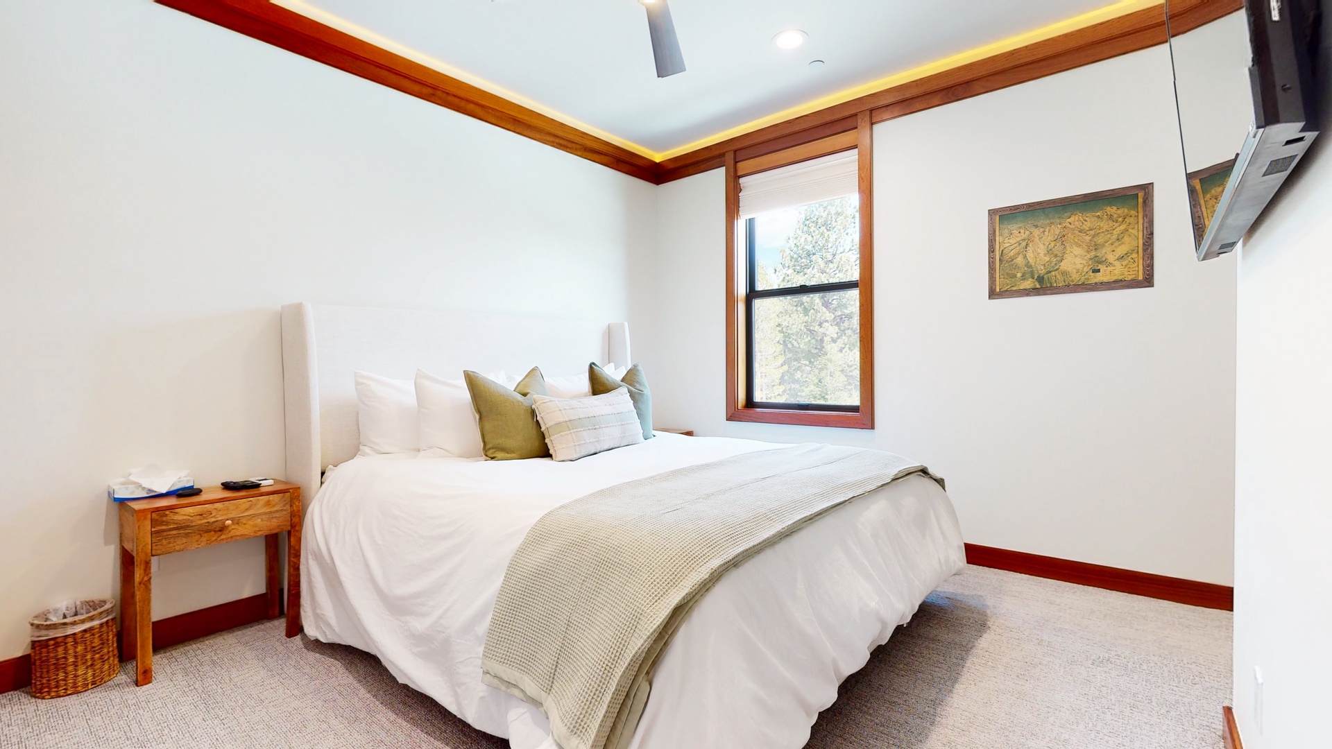 The tranquil 3rd floor king bedroom offers ample space and a Smart TV