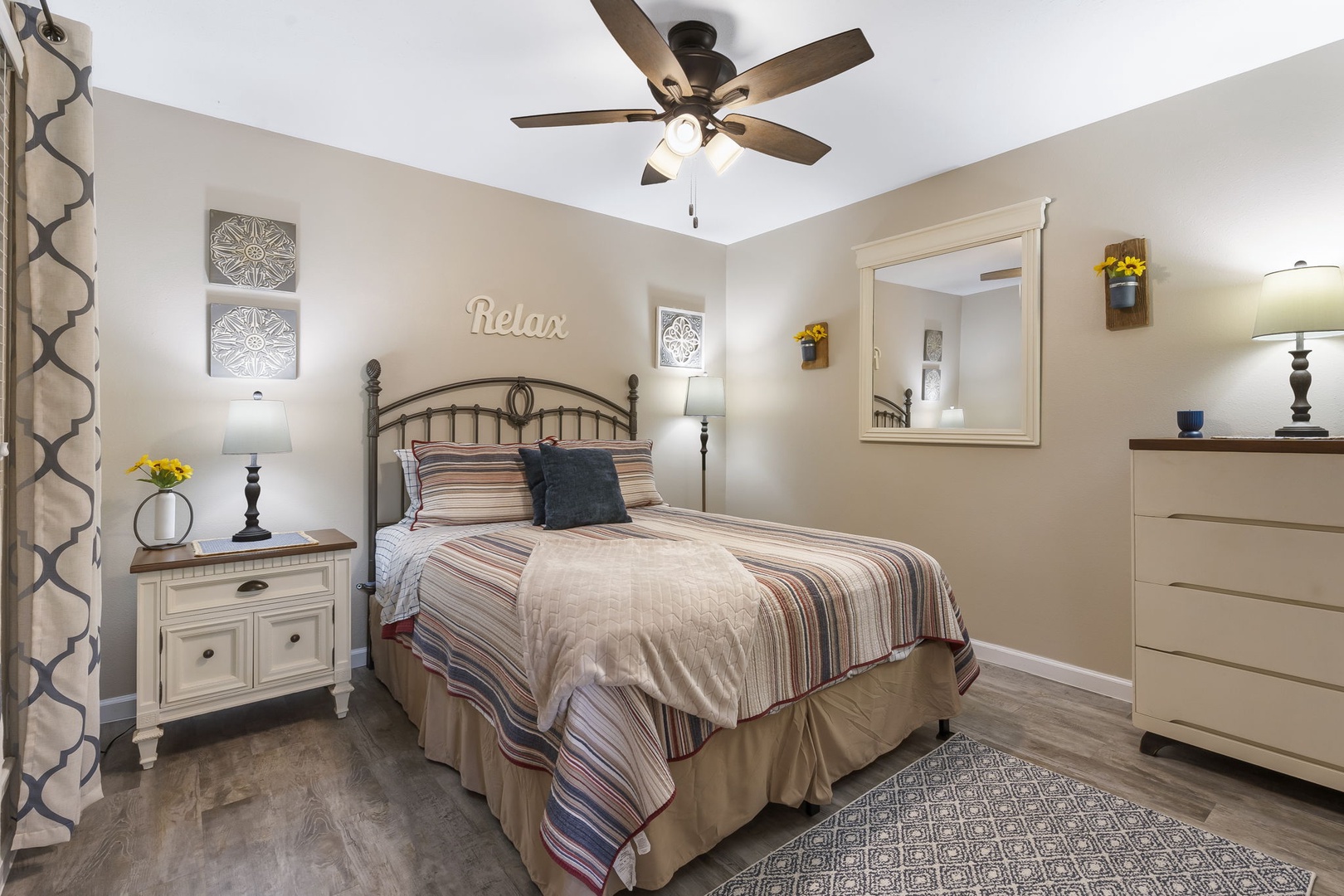 Relax in the tranquil bedroom, complete with queen bed & TV