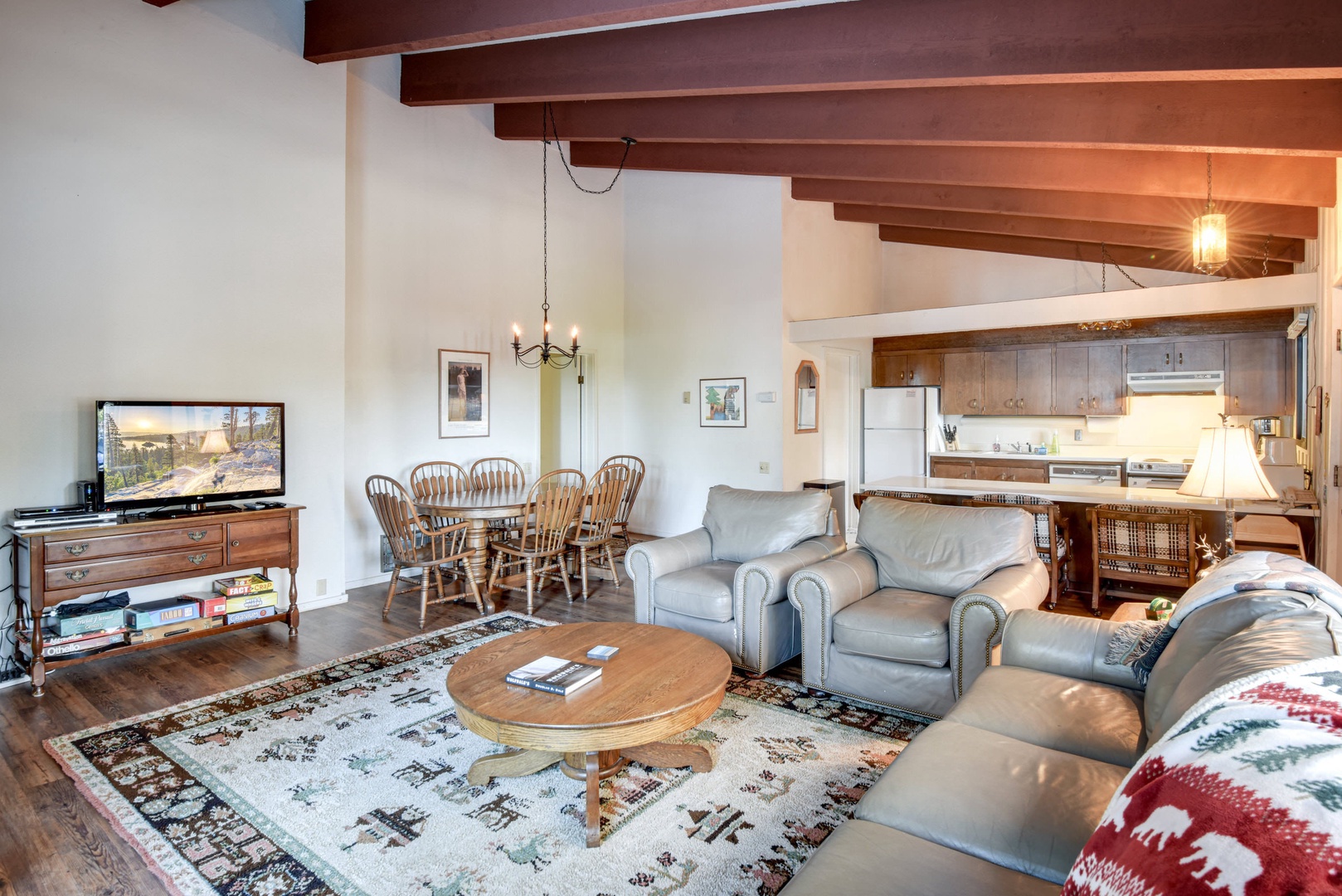 Main living area with dining table, kitchen and living room