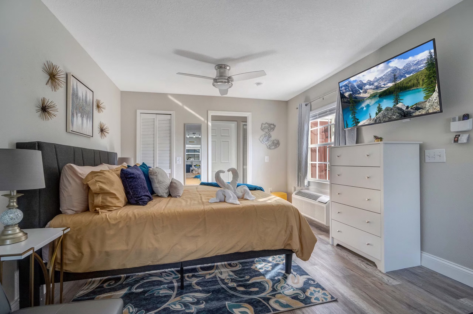 Relax in this cozy studio with a king bed, smart TV, and ceiling fan