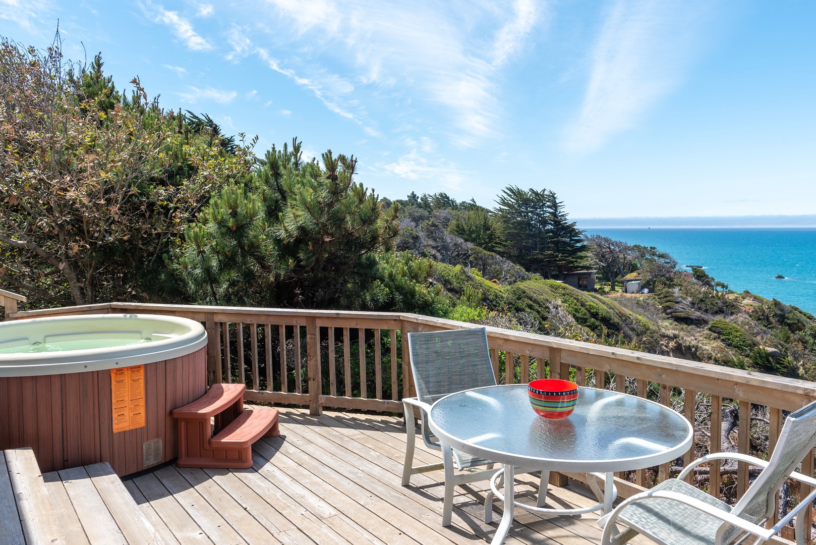 Take a soak in the hot tub overlooking the ocean view