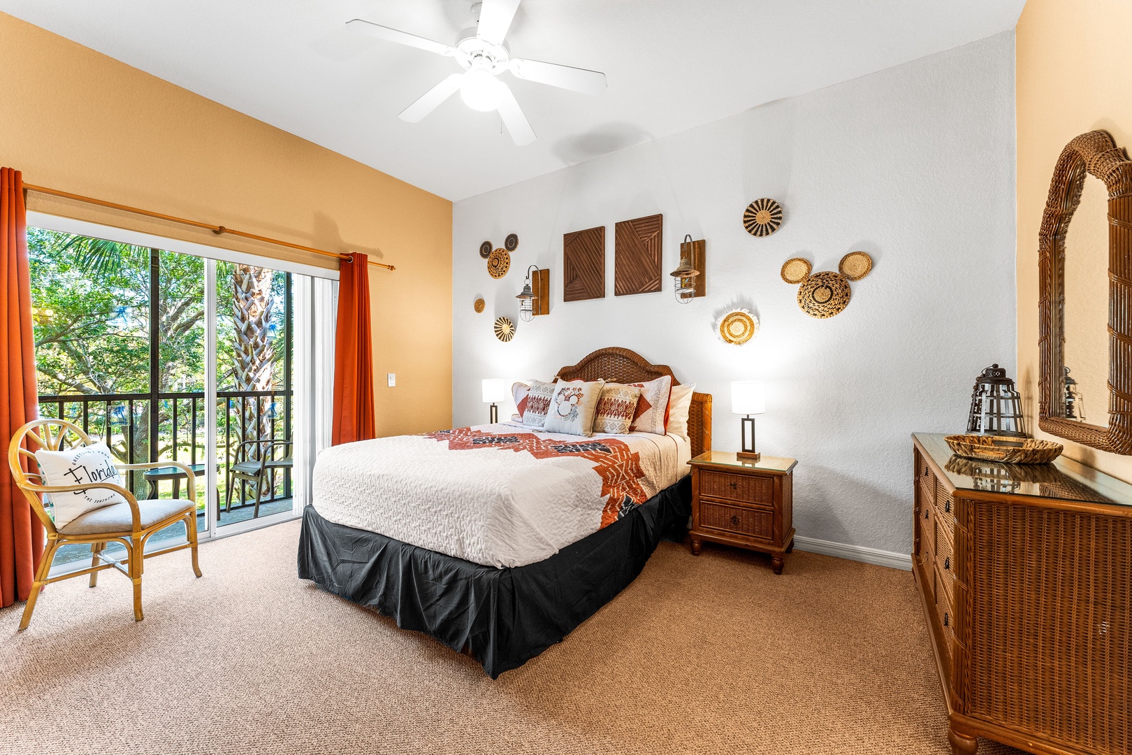 Mickey-themed queen bedroom with a private ensuite with ceiling fan