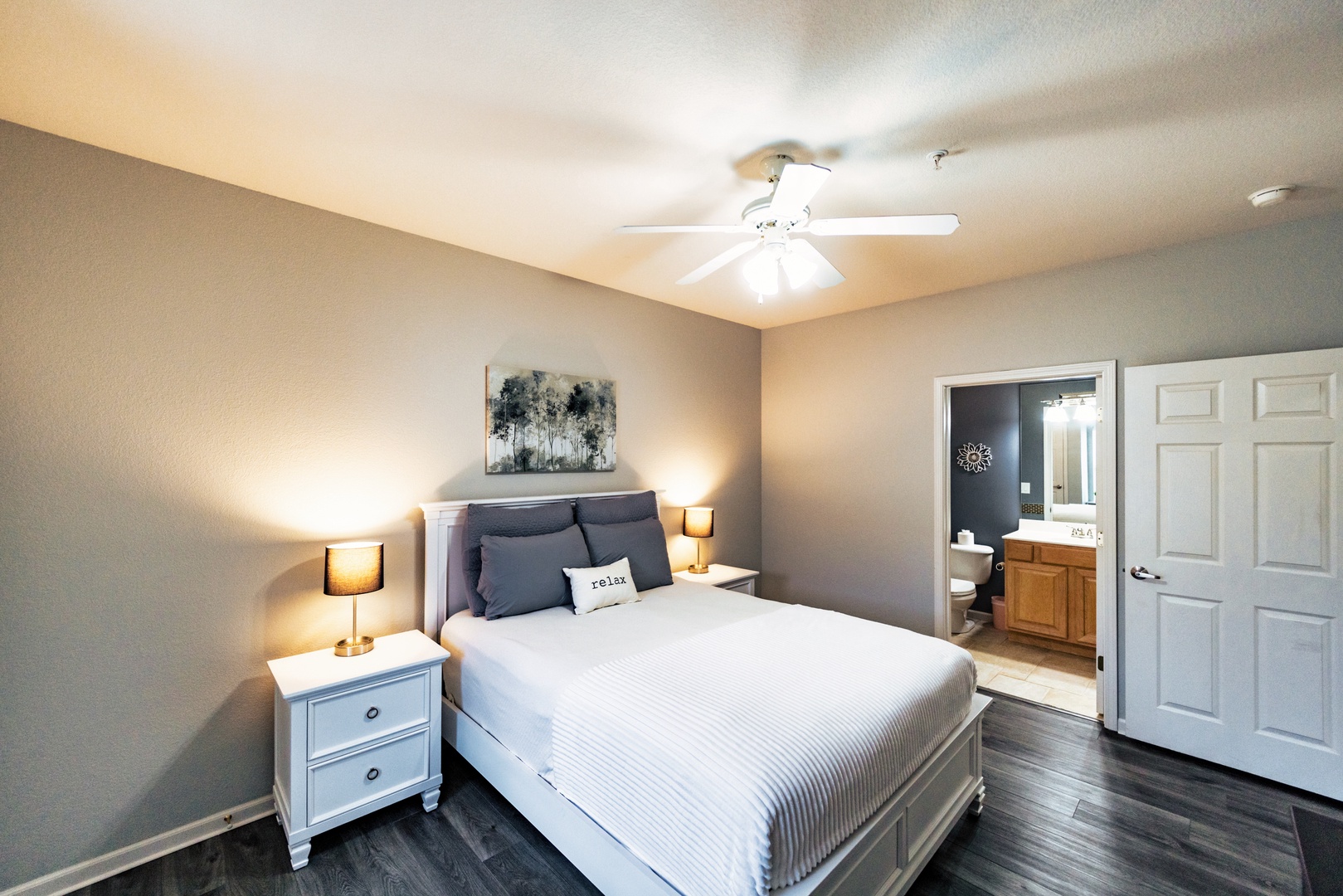 The second spacious suite offers a queen bed, ensuite bath, & TV