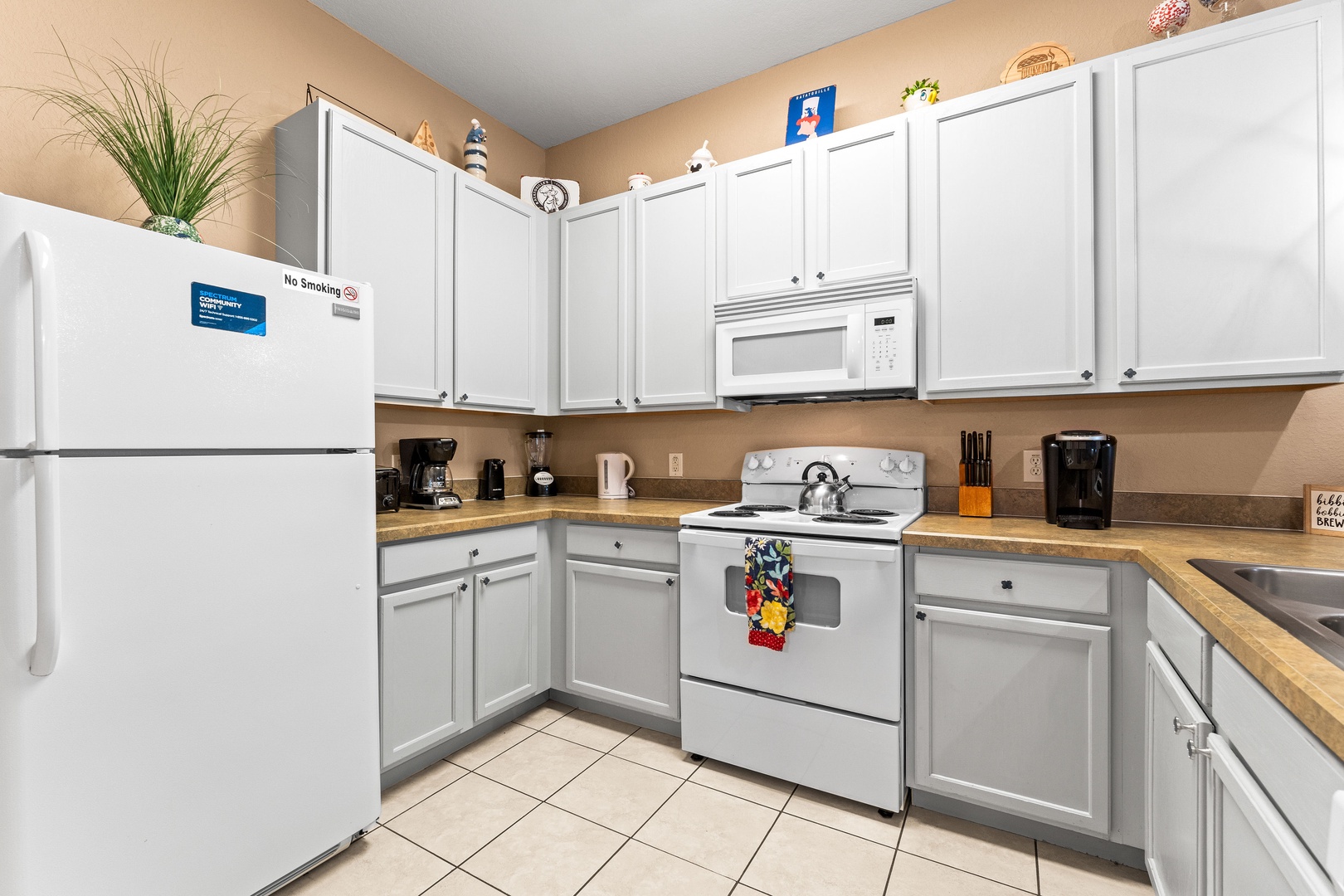 The open, airy kitchen offers ample space & all the comforts of home