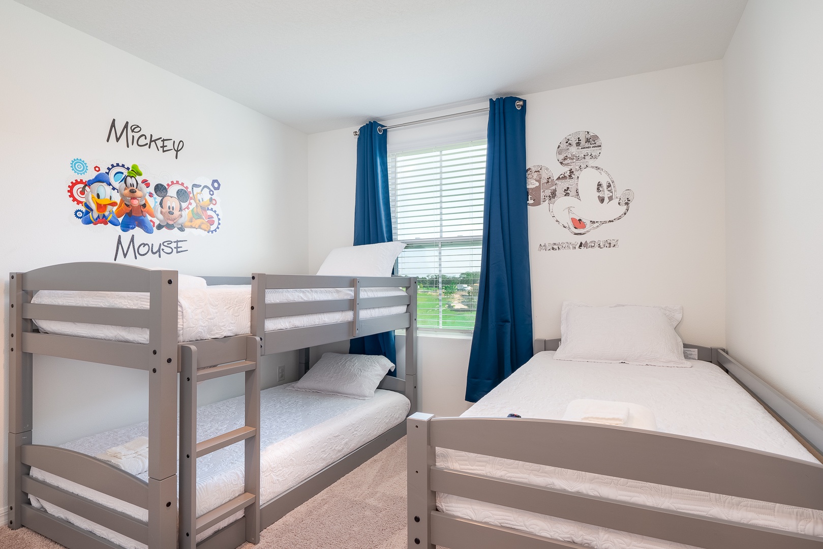 The 3rd bedroom offers a twin-over-twin bunkbed, additional twin bed, & Smart TV
