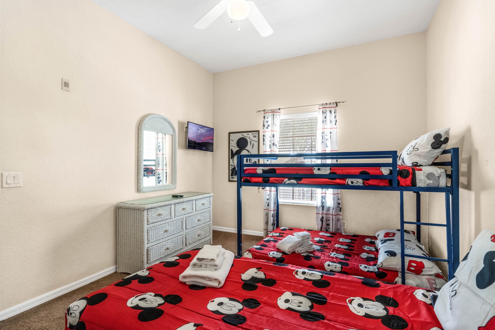 The bunk room feels like its own clubhouse, offering a full-over-full bunk and twin bed with TV