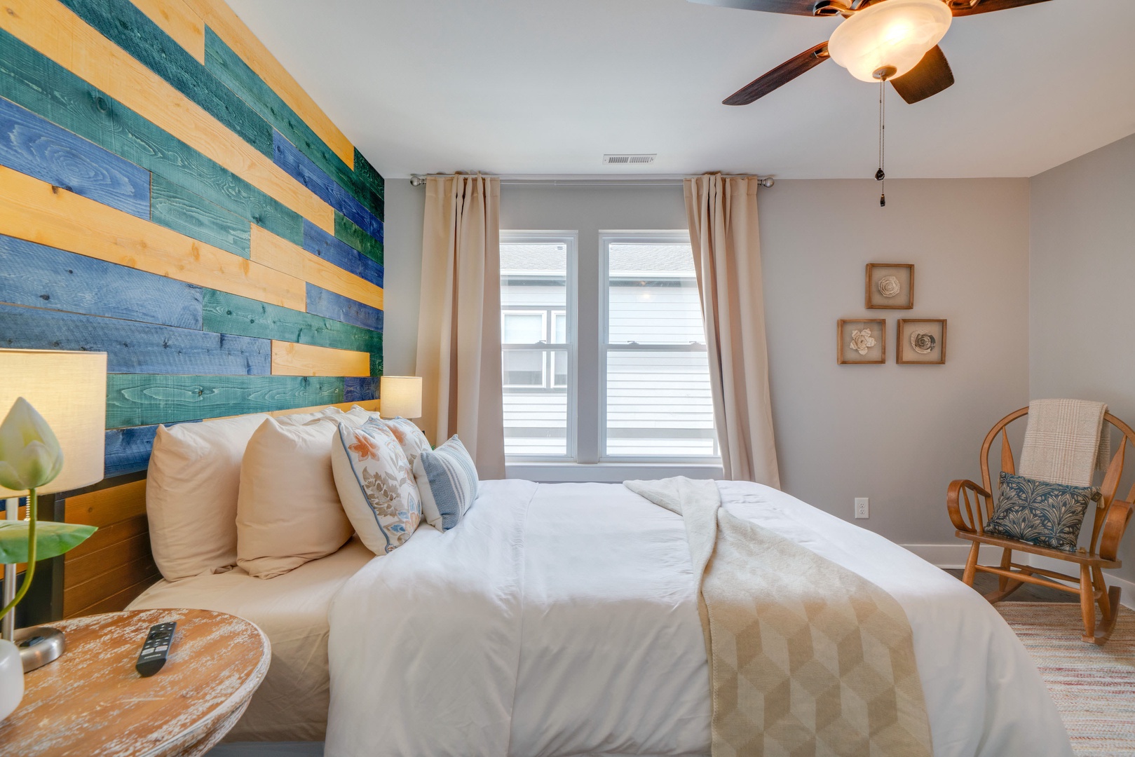 Colorful master bedroom: Queen bed with TV and en suite bathroom