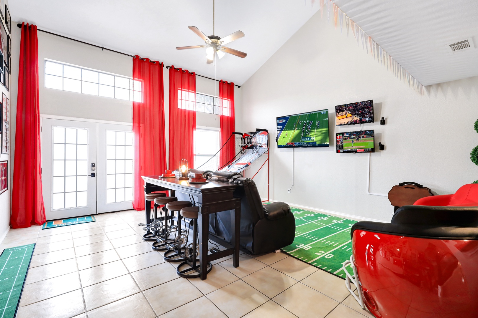 Enjoy the ultimate sports den: Smart TV, basketball, and putting green!