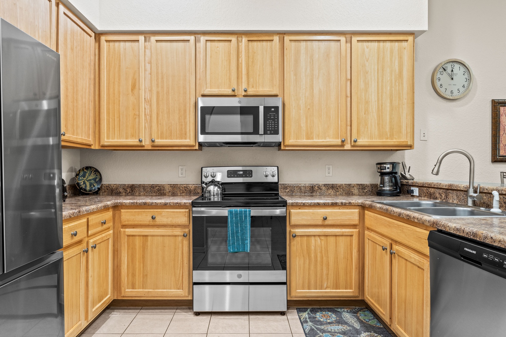 The cozy kitchen offers ample space & all the comforts of home