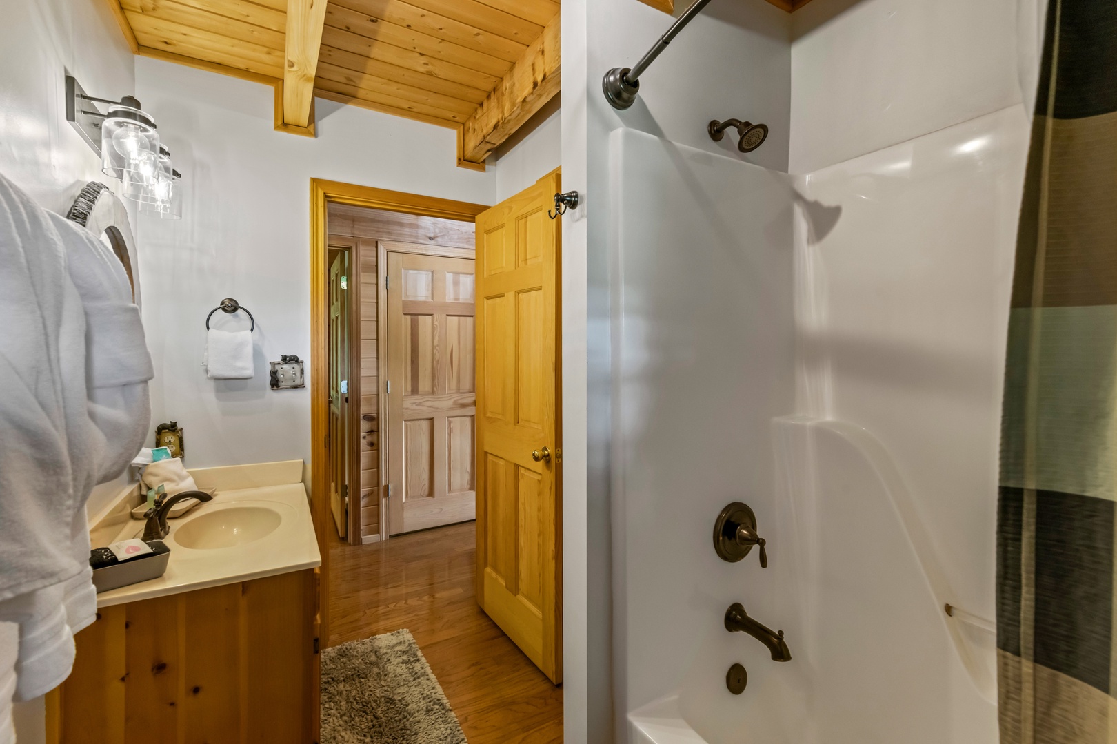 The full bath on the main floor includes a single vanity & shower/tub combo