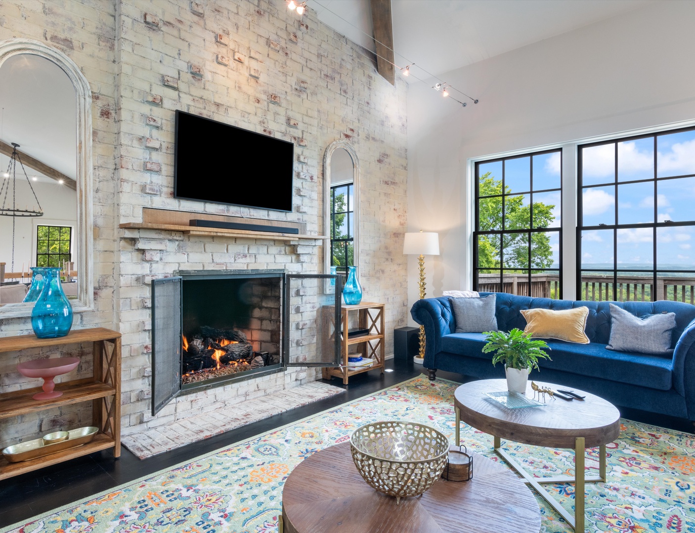 Living area with ample seating, fireplace, and Smart TV