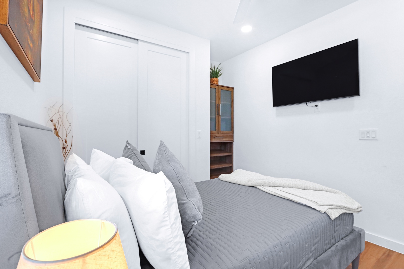 The bedroom retreat features a plush full bed, smart TV, & ensuite bath