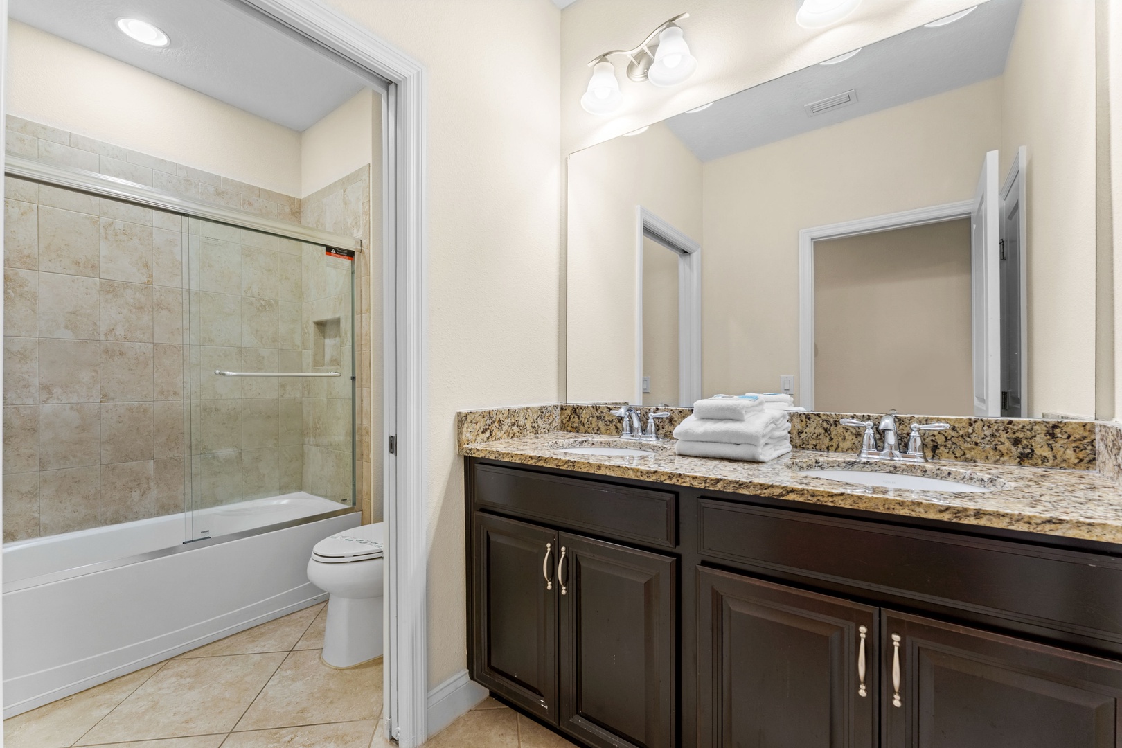 Shared bathroom with shower/tub combo