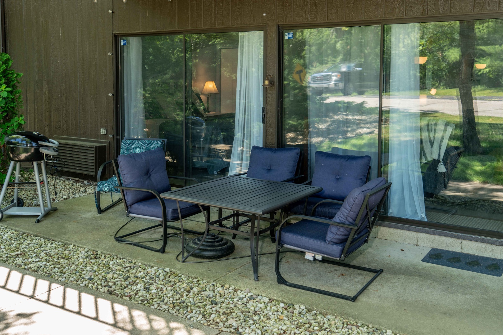 Patio with outdoor seating and grill