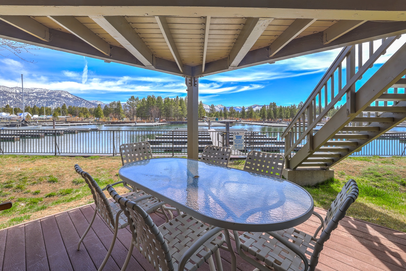Relax on the covered deck with panoramic views of the picturesque Tahoe Keys