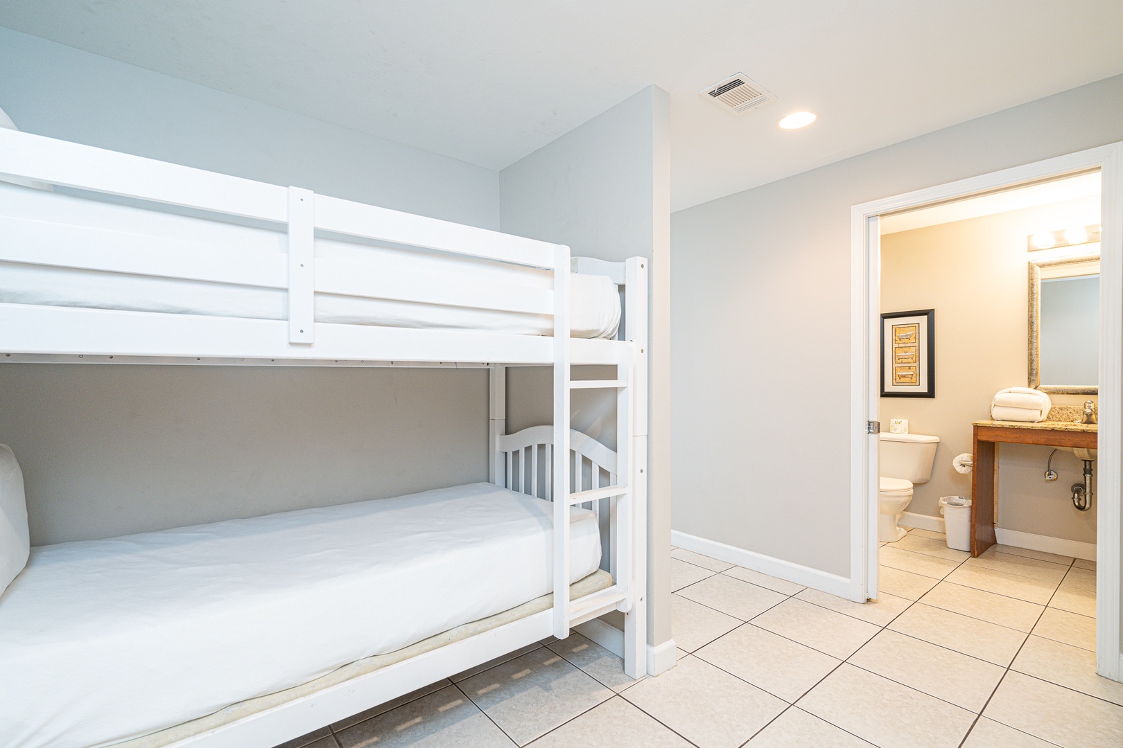 Twin-over-twin bunkbeds await in the cozy alcove