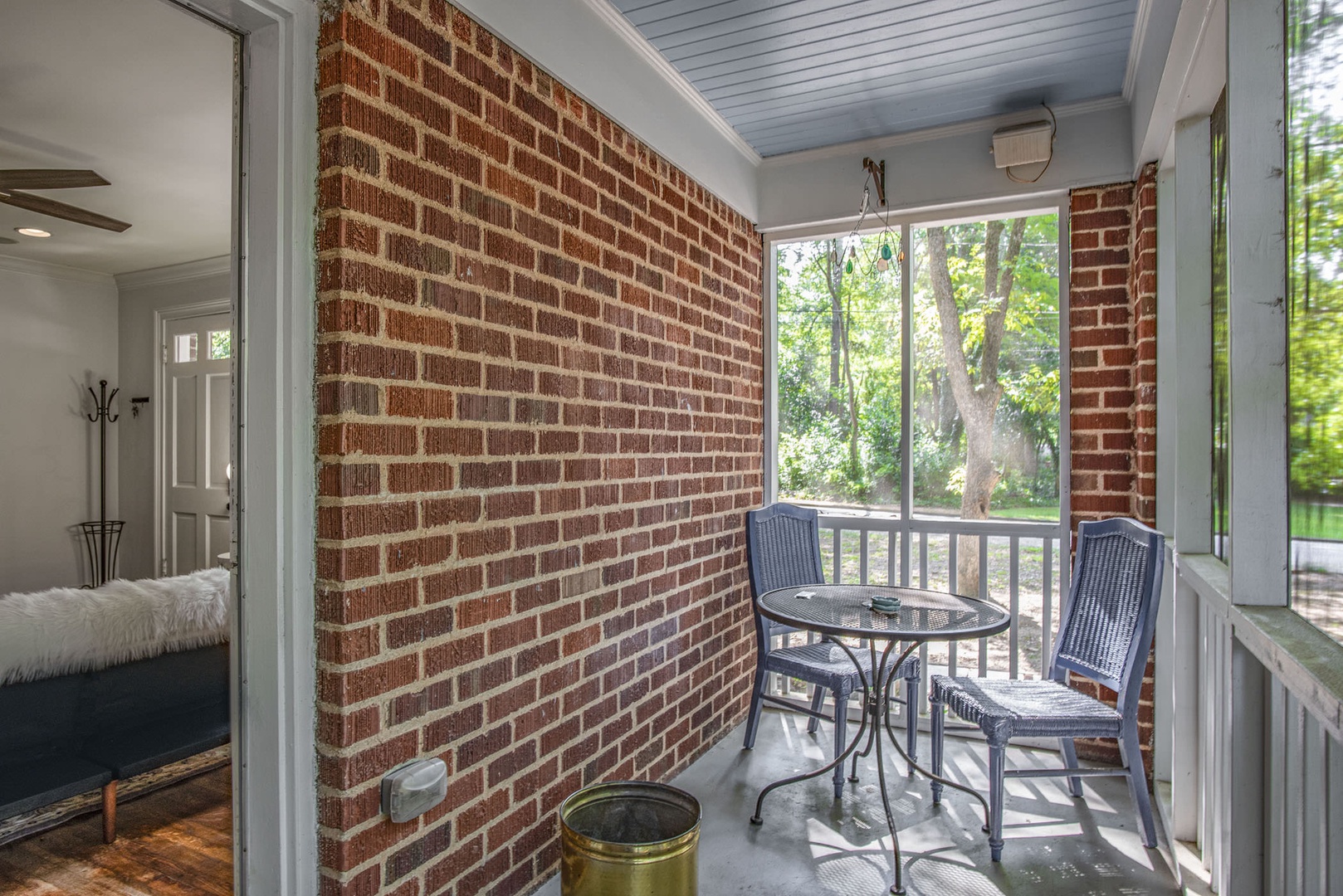 Get some fresh air out on the screened patio with seating