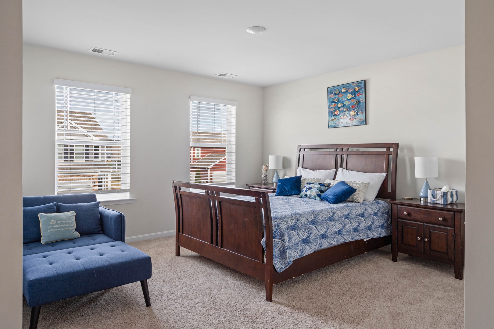 This 2nd floor bedroom retreat showcases a regal queen bed & lounge chair