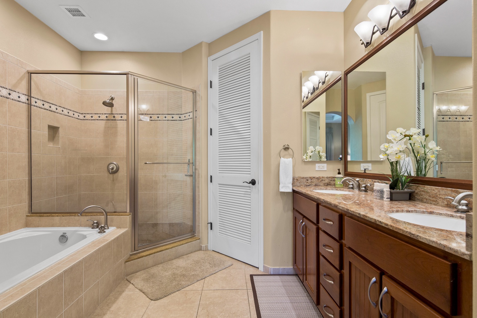 Ensuite bathroom with separate soaking tub, stand up shower and walk in closet